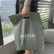 Logotip de disseny de bossa amb mànec imprès